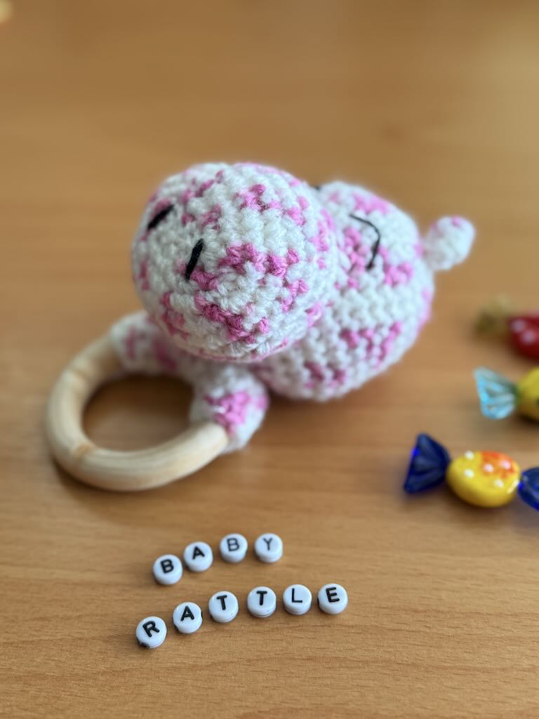 handmade crochet white hippo baby rattle with sweet smile and cozy feel