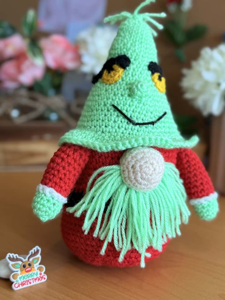 handmade crochet Grinch Santa gnome with green hat and red body