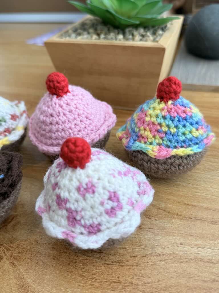 handmade crochet chocolate and cream cupcakes with cherries