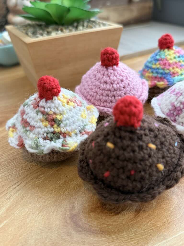 handmade crochet chocolate and cream cupcakes with cherries