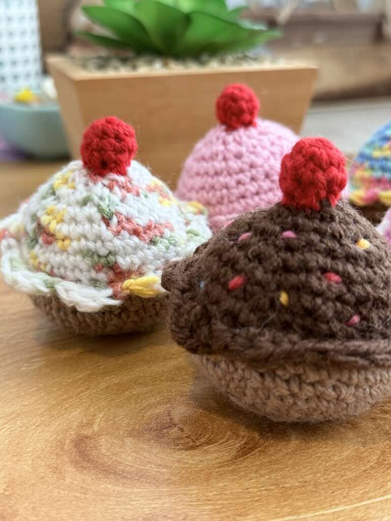 handmade crochet chocolate and cream cupcakes with cherries