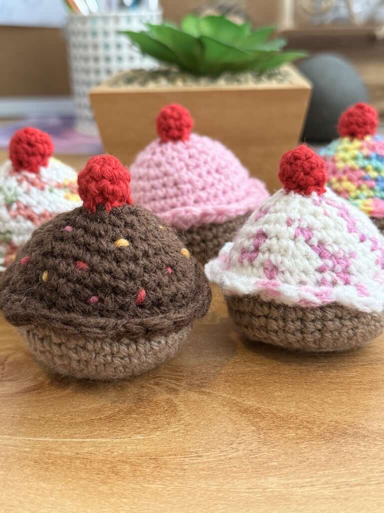 handmade crochet chocolate and cream cupcakes with cherries