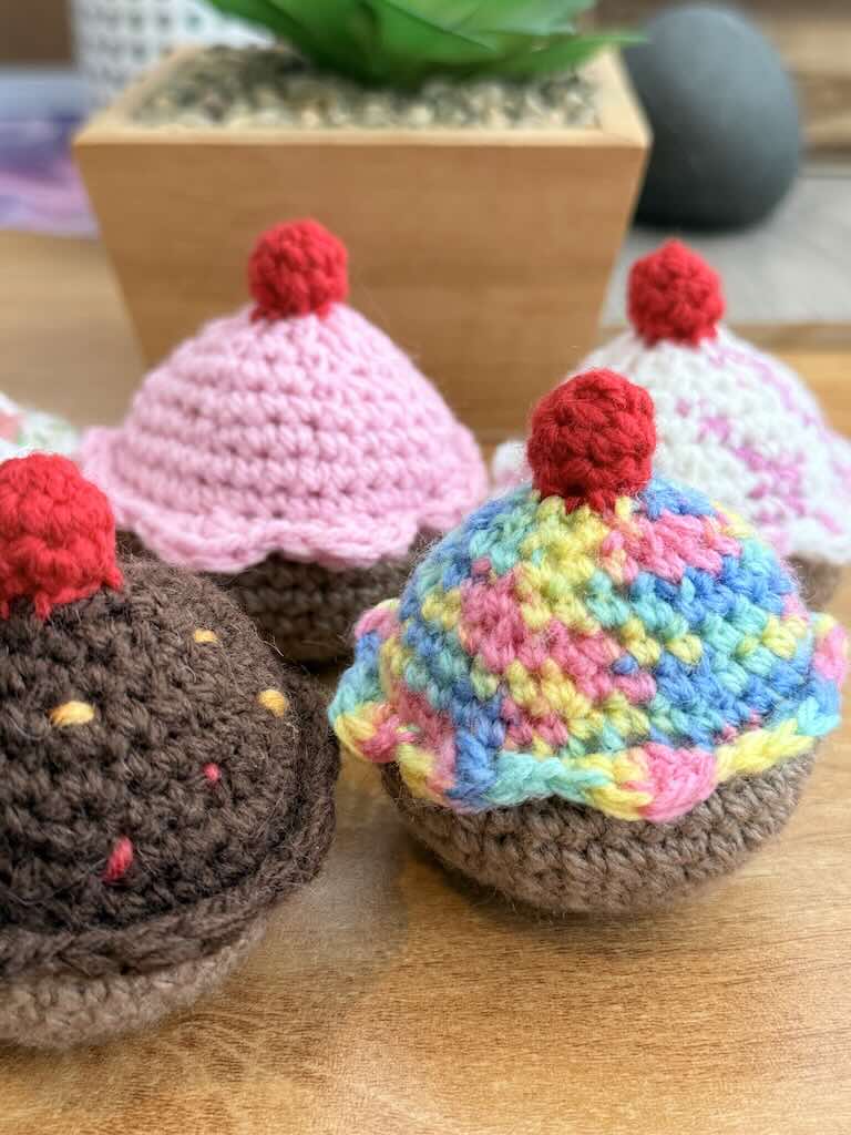 handmade crochet chocolate and cream cupcakes with cherries