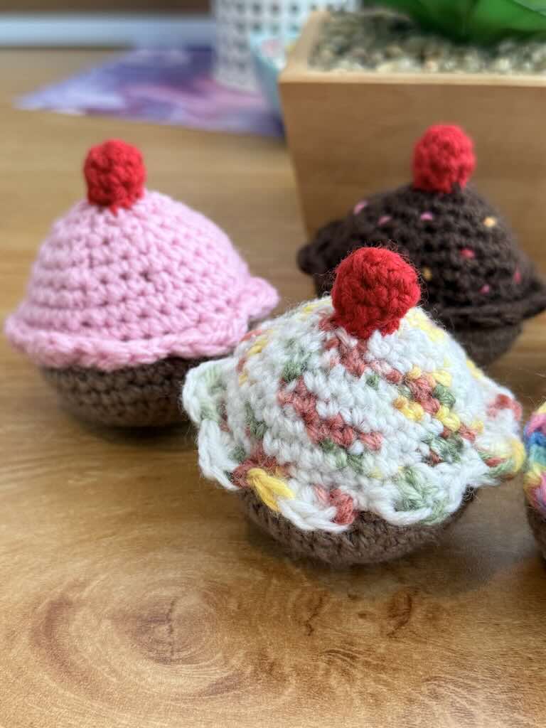 handmade crochet chocolate and cream cupcakes with cherries