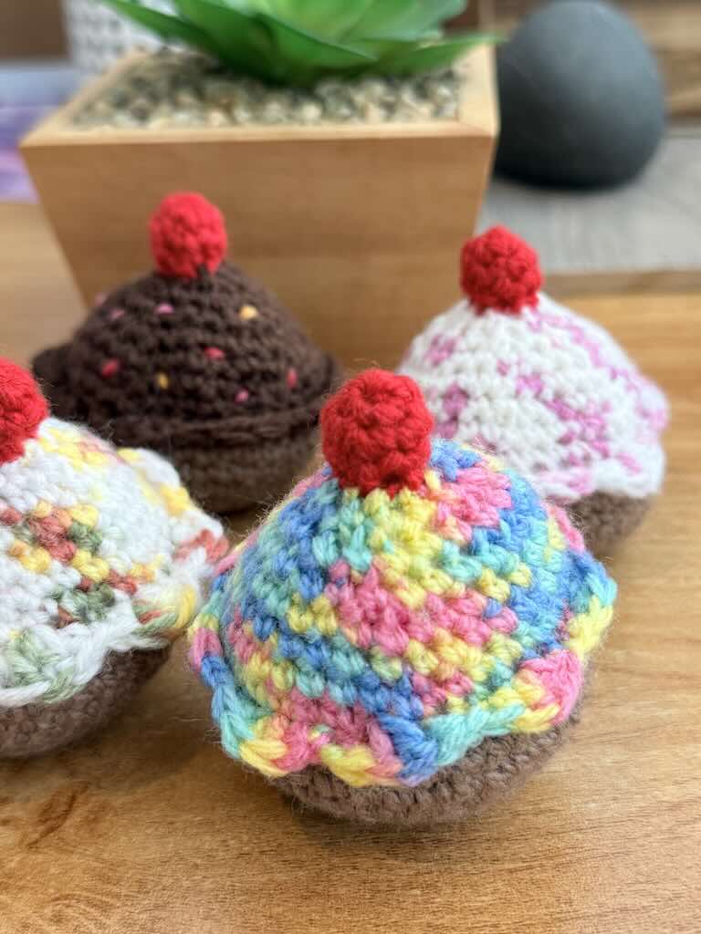 handmade crochet chocolate and cream cupcakes with cherries