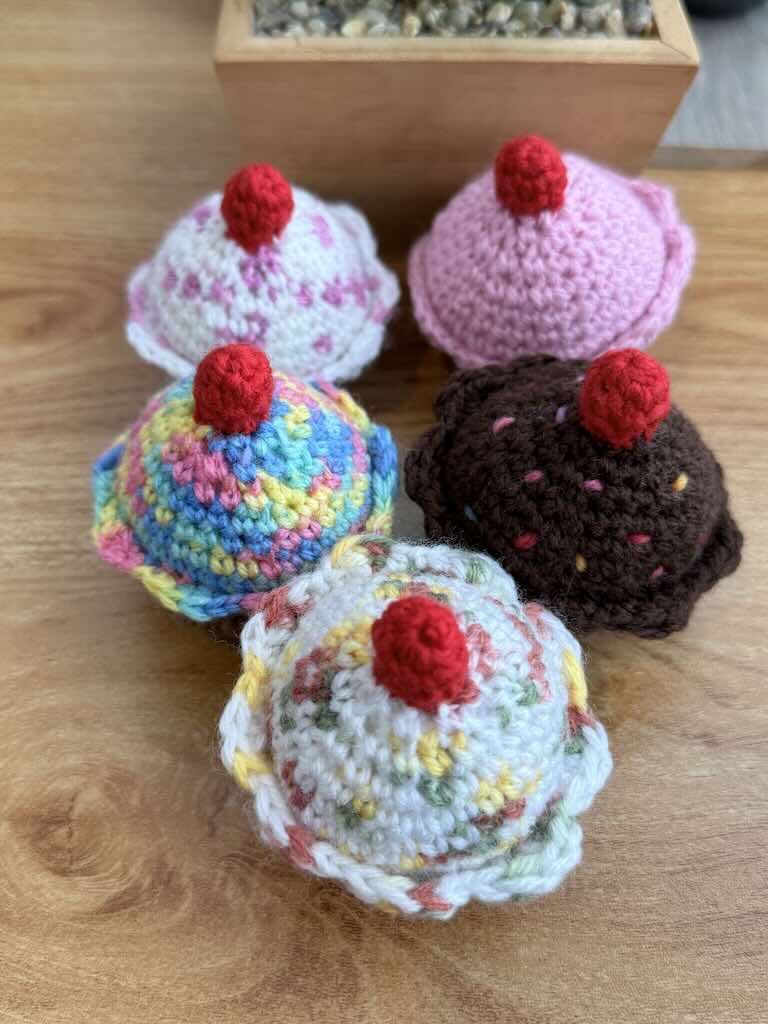 handmade crochet chocolate and cream cupcakes with cherries