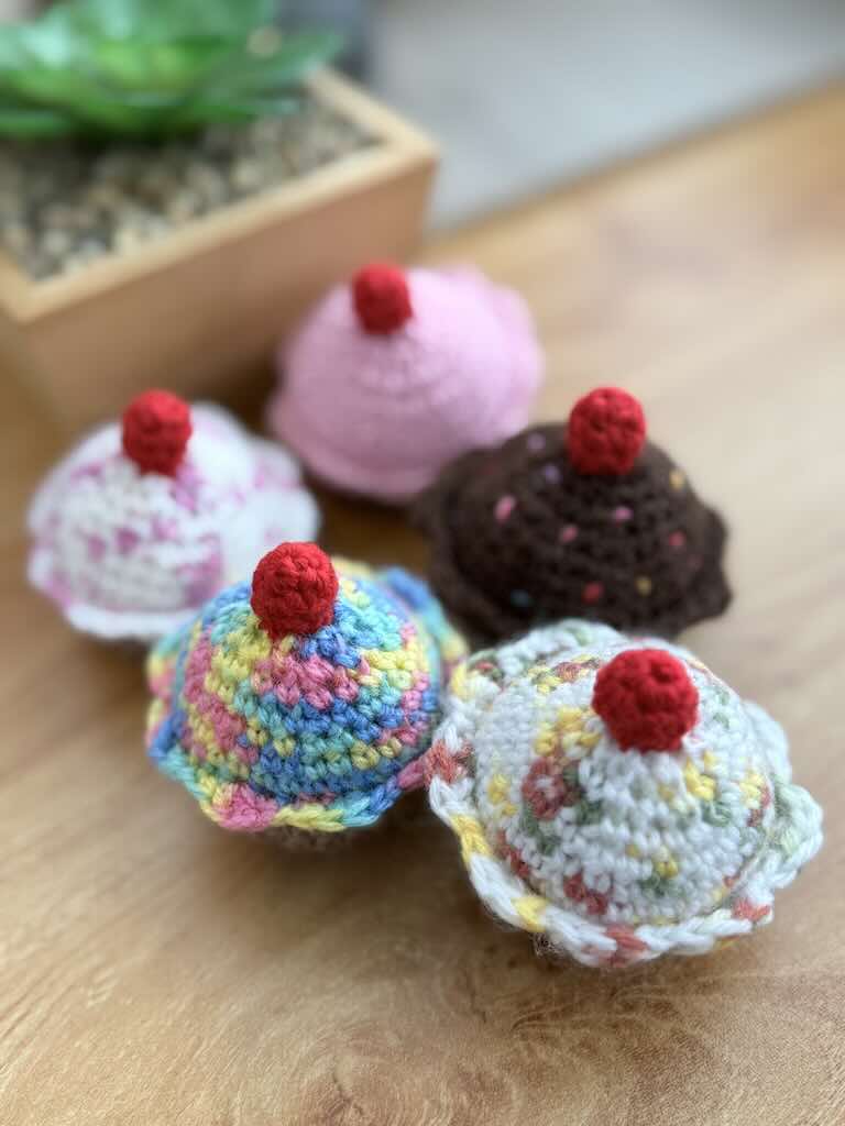 handmade crochet chocolate and cream cupcakes with cherries