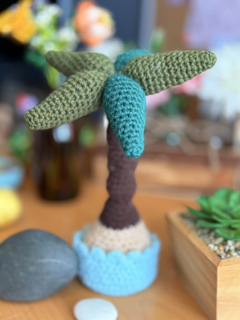 crochet potted palm tree with green leaves and brown trunk