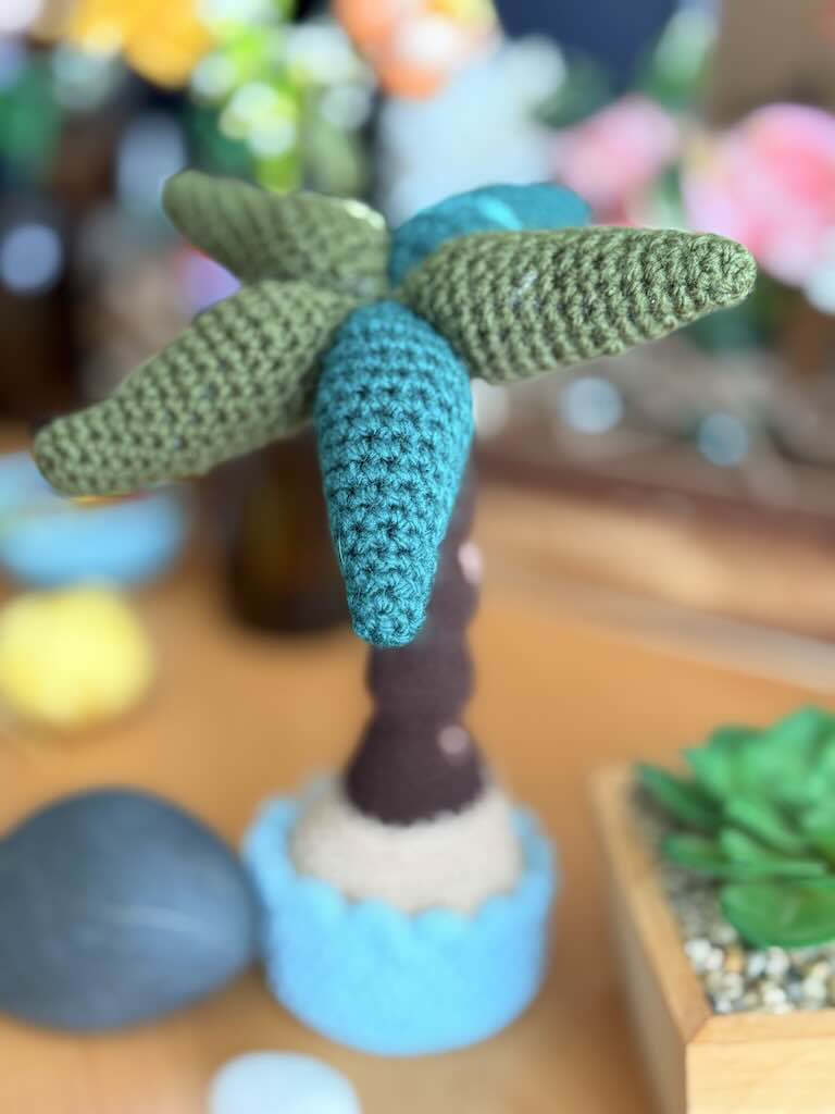 crochet potted palm tree with green leaves and brown trunk