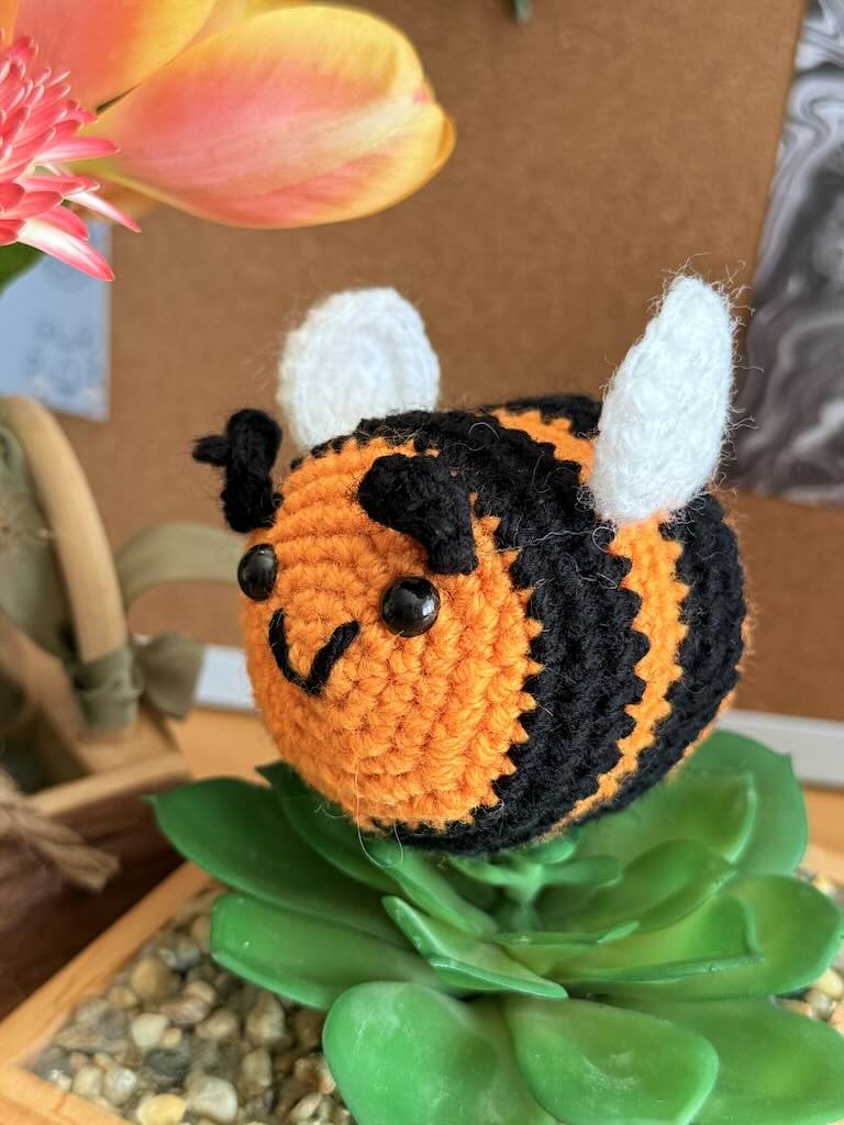 crochet little bee with orange and black stripes