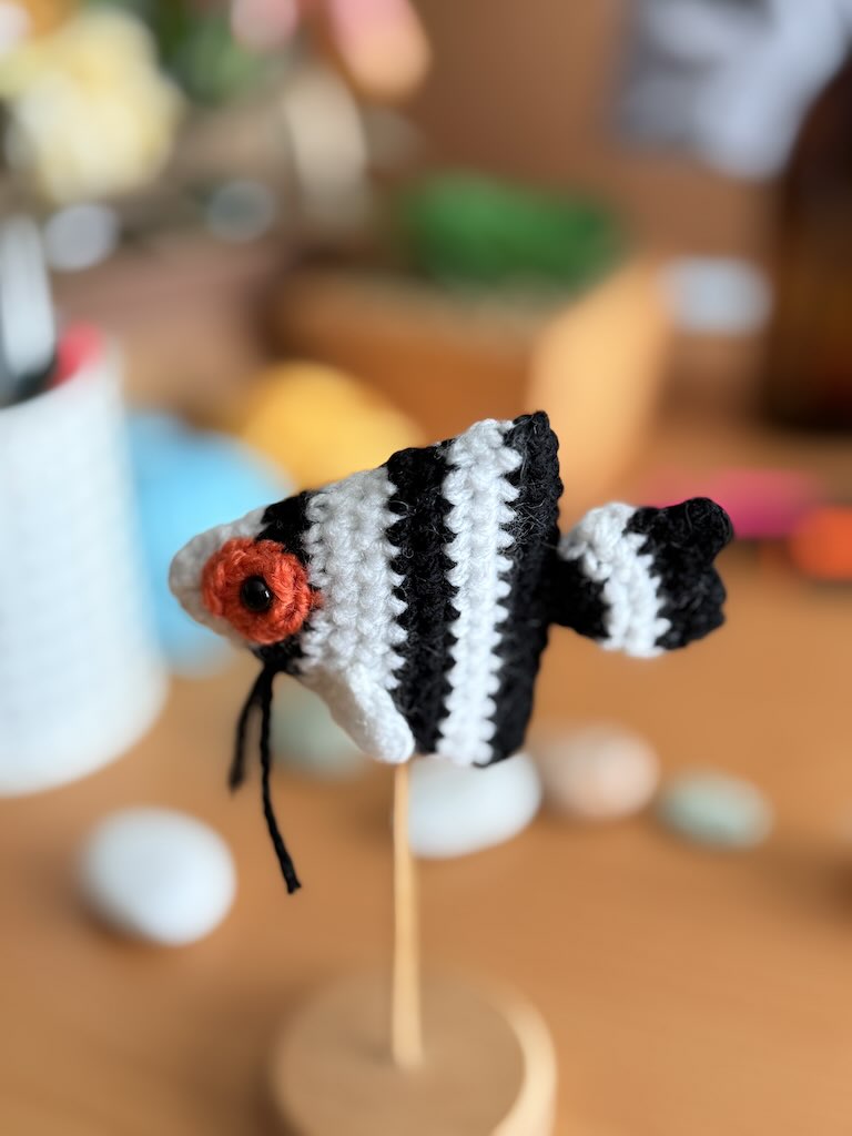 handmade crochet angelfish keychain with black and white stripes