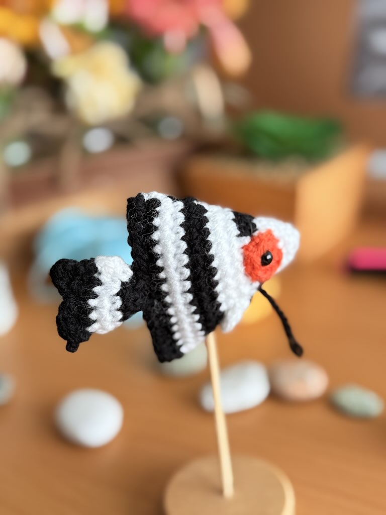 handmade crochet angelfish keychain with black and white stripes