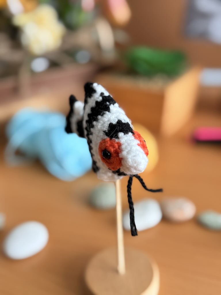 handmade crochet angelfish keychain with black and white stripes