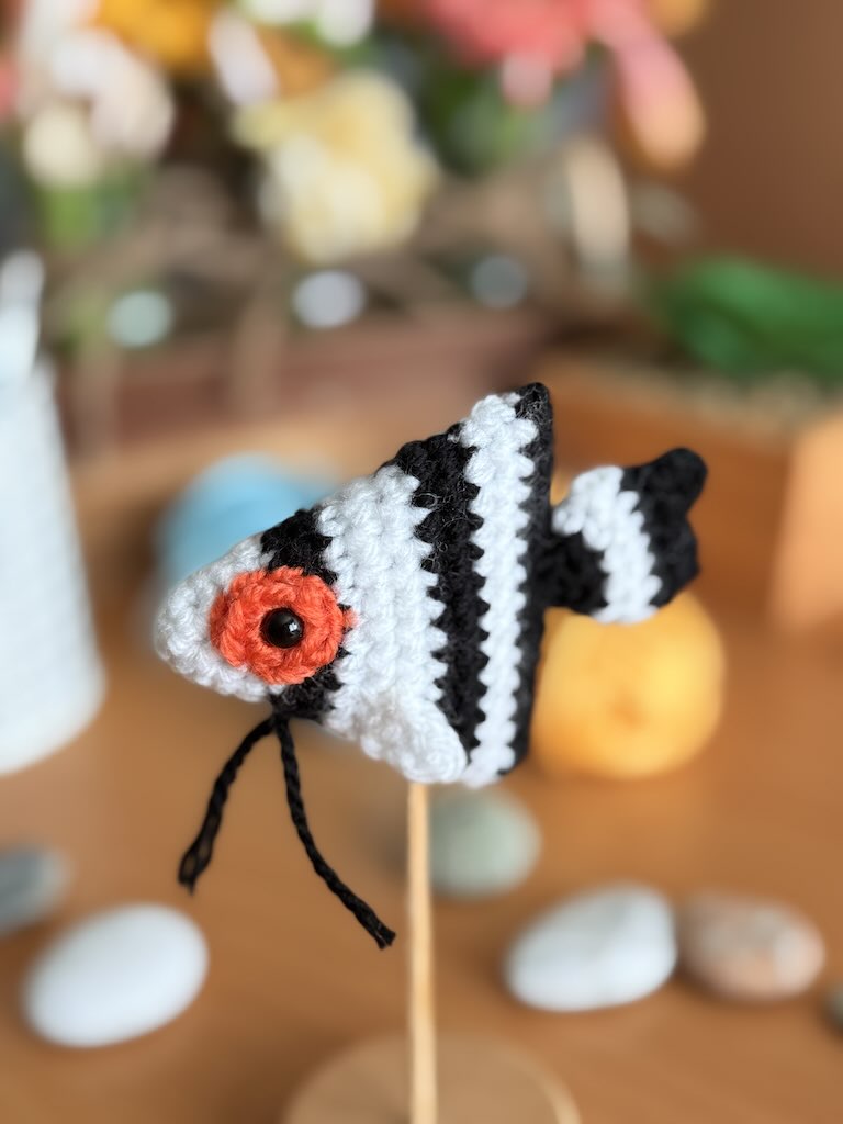 handmade crochet angelfish keychain with black and white stripes