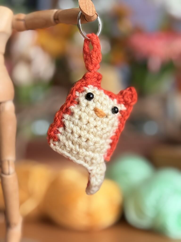 keychain crochet cat toy with red and gray yarn pattern