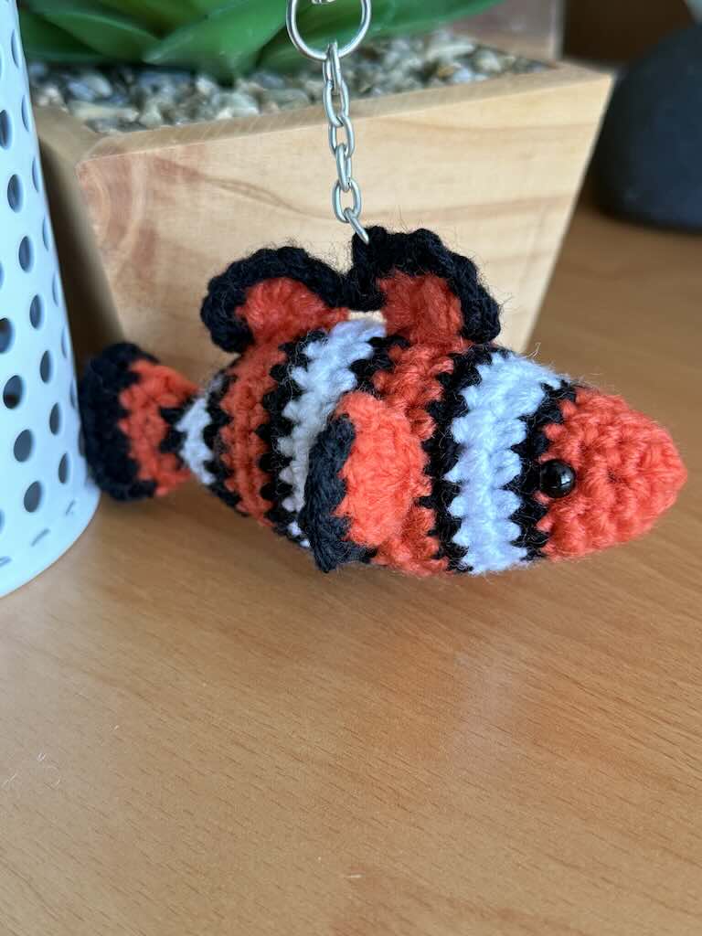 keychain crochet clown fish toy with orange, black and white stripes