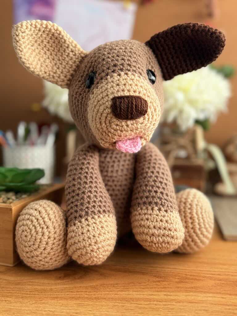 handmade crochet dog named Dipsy with big floppy ears and a pink tongue