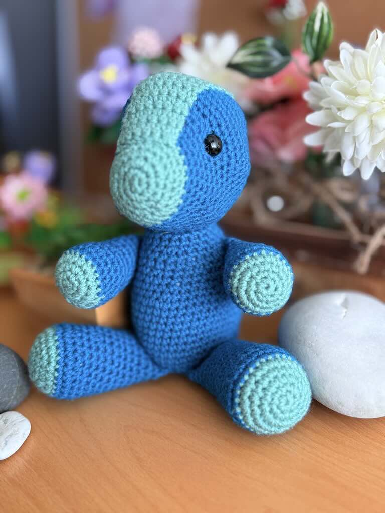 handmade crochet blue Parasaurolophus dinosaur named Peter with curved crest
