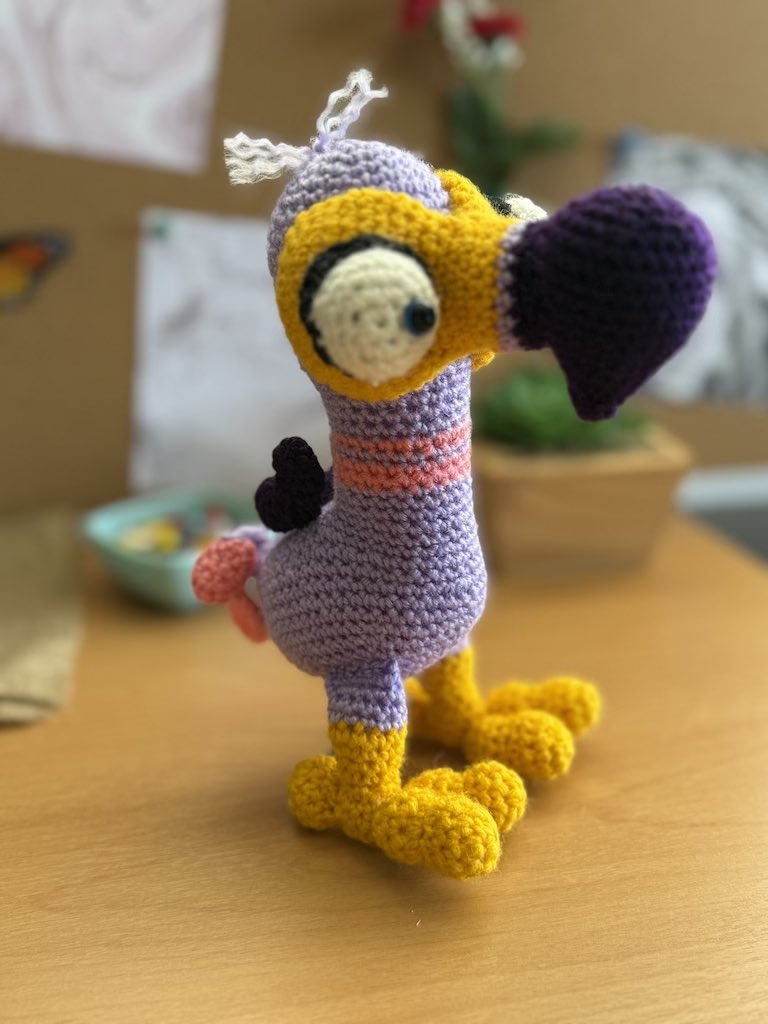 handmade crochet dodo bird toy named Donna with soft colorful yarn