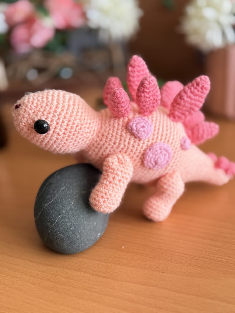 handmade crochet stegosaurus dinosaur toy named Simon with plated back