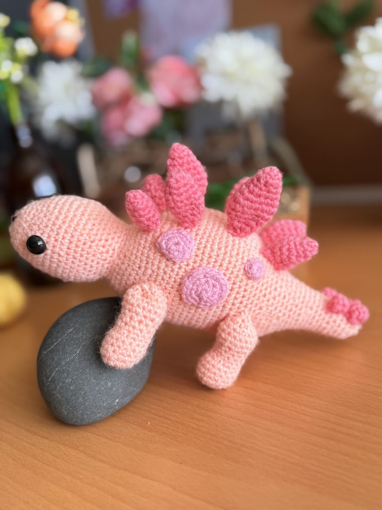 handmade crochet stegosaurus dinosaur toy named Simon with plated back