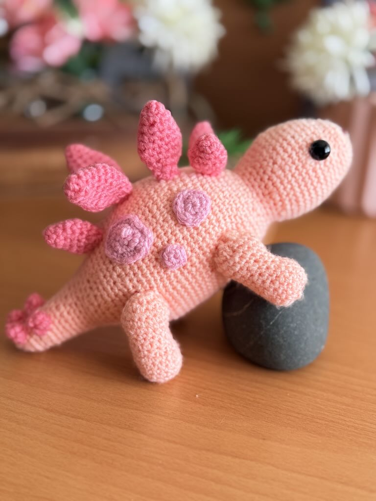 handmade crochet stegosaurus dinosaur toy named Simon with plated back