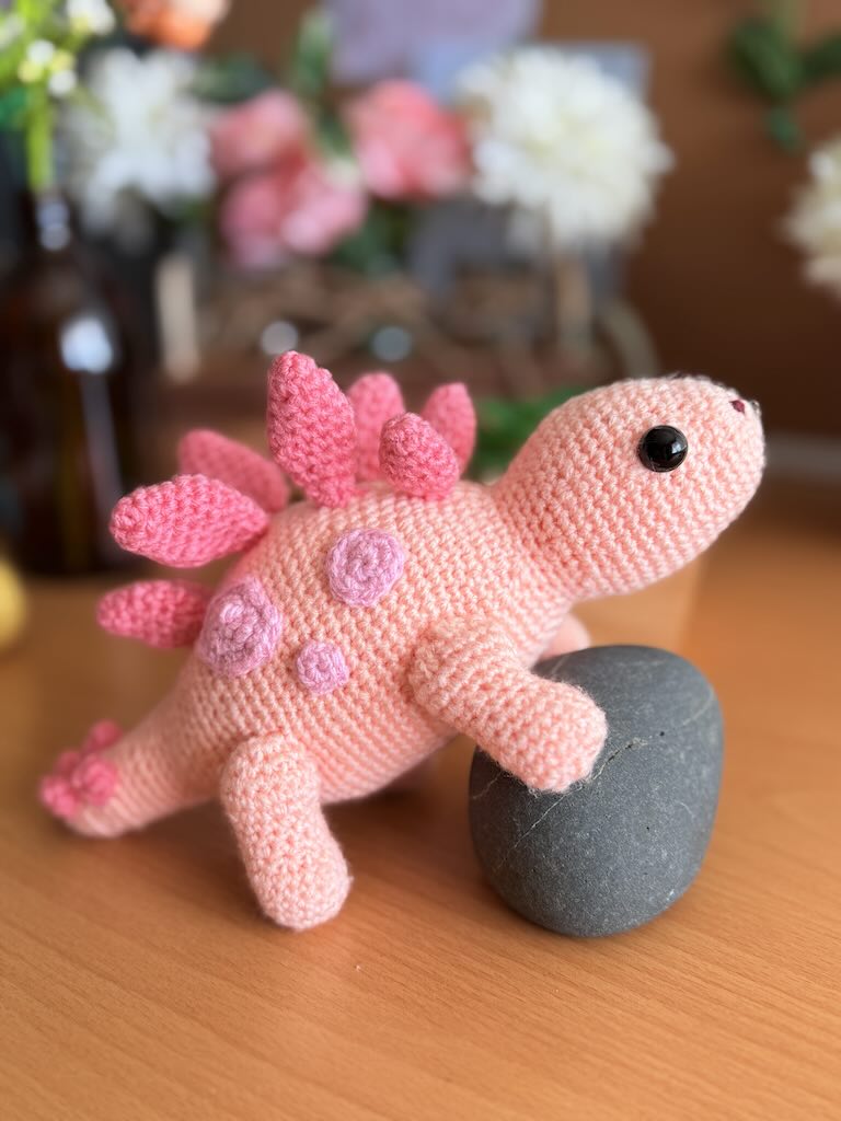handmade crochet stegosaurus dinosaur toy named Simon with plated back