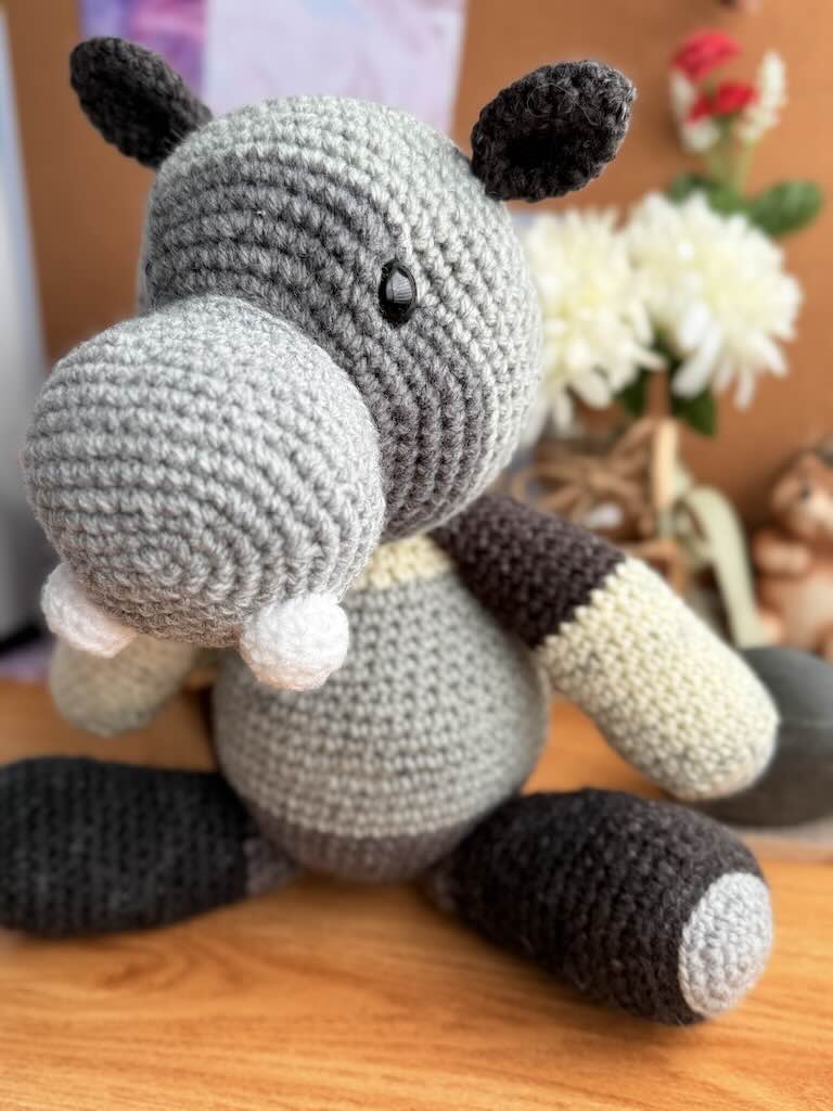 handmade crochet hippo toy named Honey with soft yarn and happy face