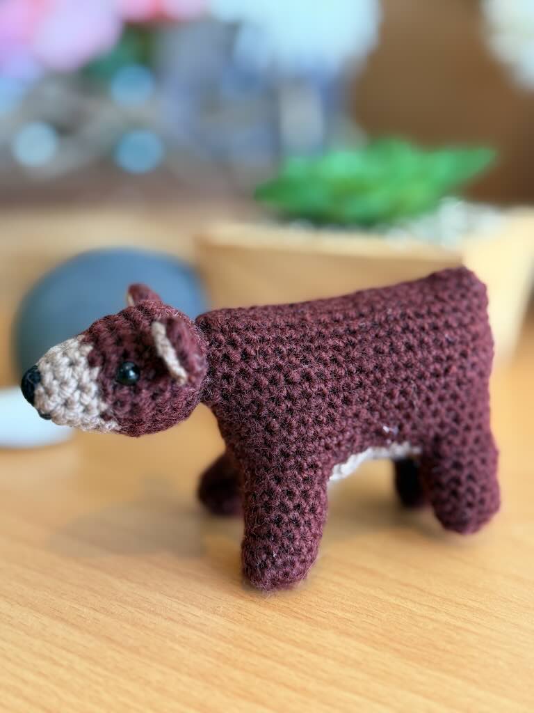 handmade crochet little brown bear toy with soft fur and friendly expression