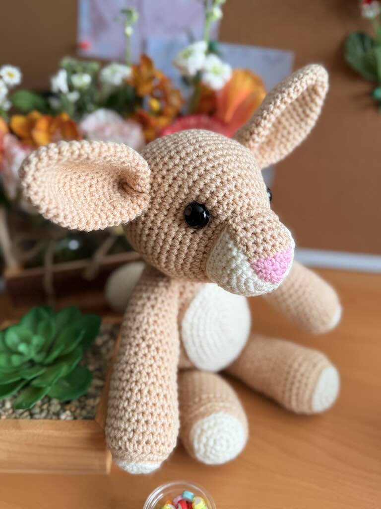 handmade crochet light-brown rabbit toy with long ears and gentle face