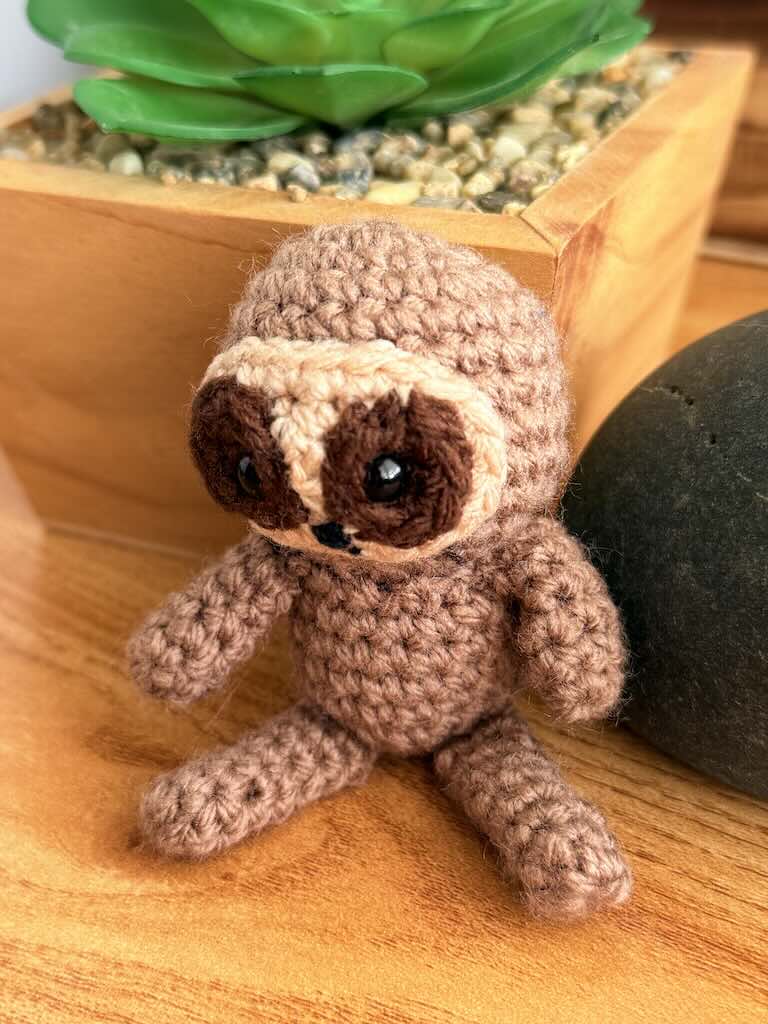 handmade crochet sloth toy named Spud with cozy yarn and lazy charm
