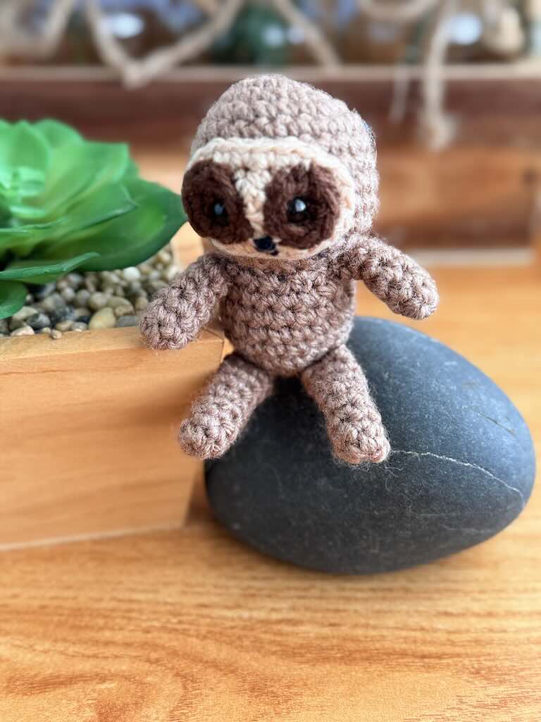 handmade crochet sloth toy named Spud with cozy yarn and lazy charm