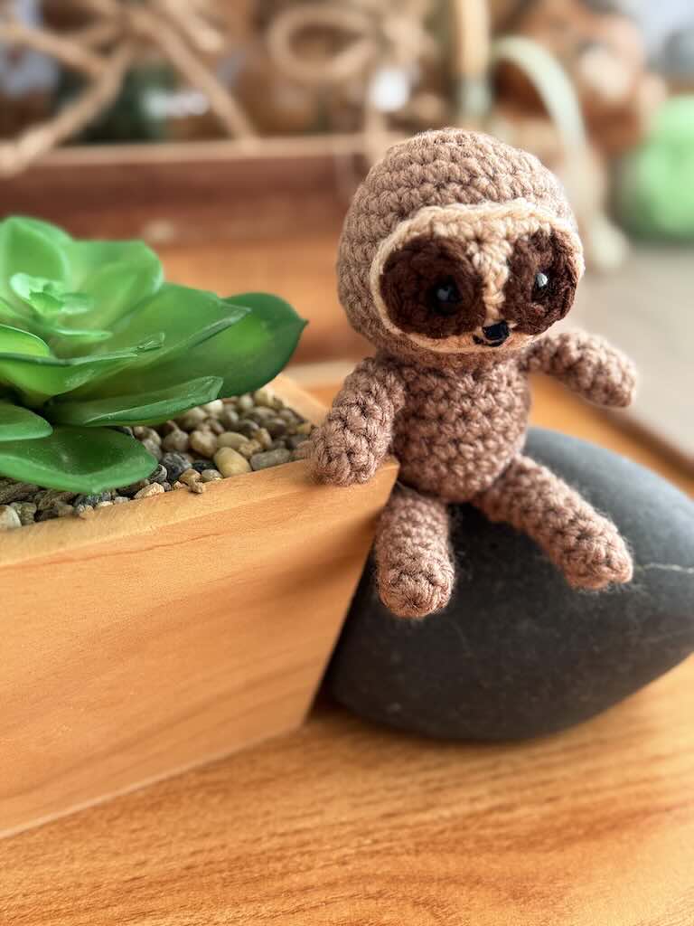 handmade crochet sloth toy named Spud with cozy yarn and lazy charm
