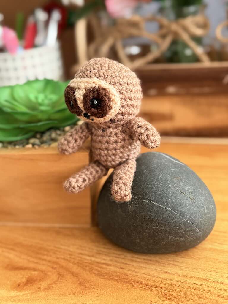 handmade crochet sloth toy named Spud with cozy yarn and lazy charm